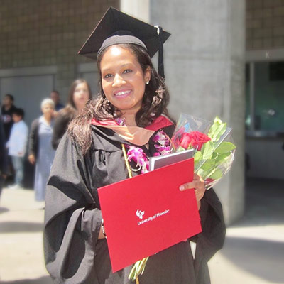 Michelle in graduation regalia after her completing her master's degree