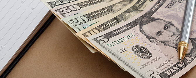 Image of cash, pen and diary