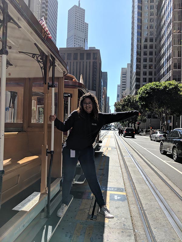 Intern Godis Jackson on a San Francisco cable car