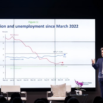 President Daly presenting figure a on inflation and unemployment.