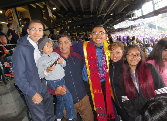 Angel with his family at his college graduation in 2018.