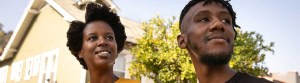 African American Couple Outside Los Angeles Home