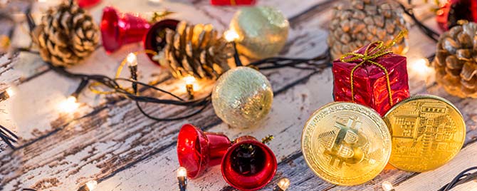 Gold Bitcoin on Table with Holiday Decorations and Lights