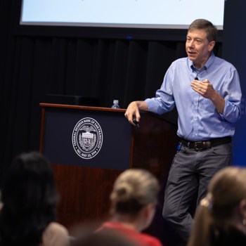 Man standing in front of a podium.