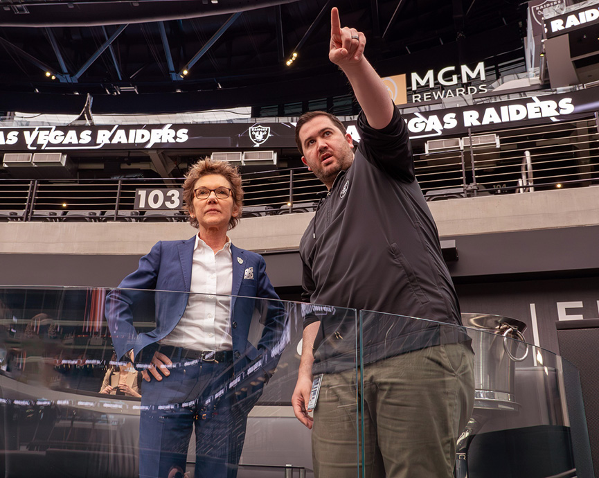 SF Fed President and CEO Mary C. Daly interacting with a member of the public.