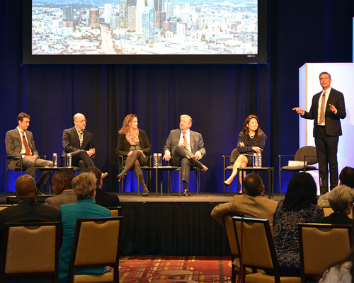 Photo of David Erickson moderating panel discussion at 2016 NICRC