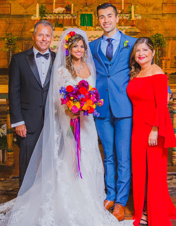 Kylie and her husband Max on their wedding day, with Kylie’s parents.