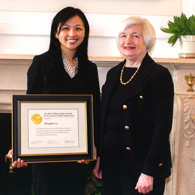 Mongkha Pavlick receives the 2013 William Taylor Award for Excellence in Bank Supervision from Janet Yellen.
