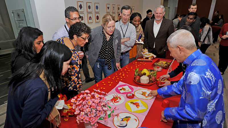 An InspirAsian member exhibits Vietnamese cultural items during the Lunar New Year celebration in 2019.