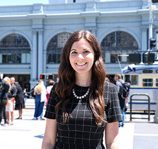 Michelle Poya Stands in Front of the San Francisco Ferry Building