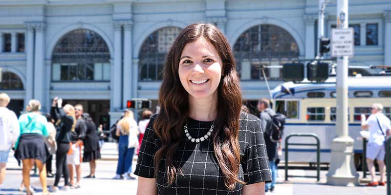 Michelle Poya Stands in Front of the San Francisco Ferry Building