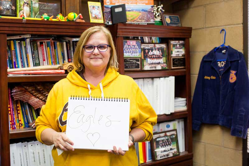 Ms. Best with sign reading Eagles