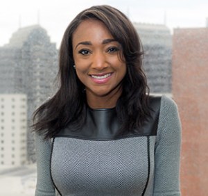 Photo of Naiema Blanchard with cityscape background