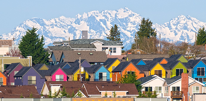 Rows of homes with the Olympic Mountain range in the background.