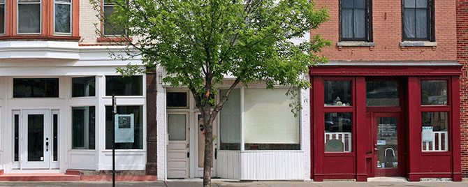 Row of apartments and storefronts representing community
