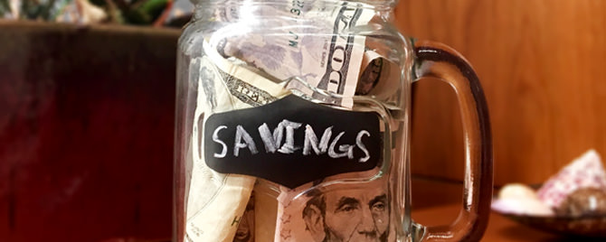 Image of $5 US Currency in Savings Jar