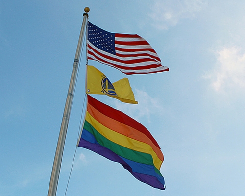 Photo of flags on the roof of SF Fed headquarters June 2016