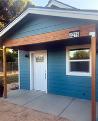 Exterior of an ADU showing the front door and window.