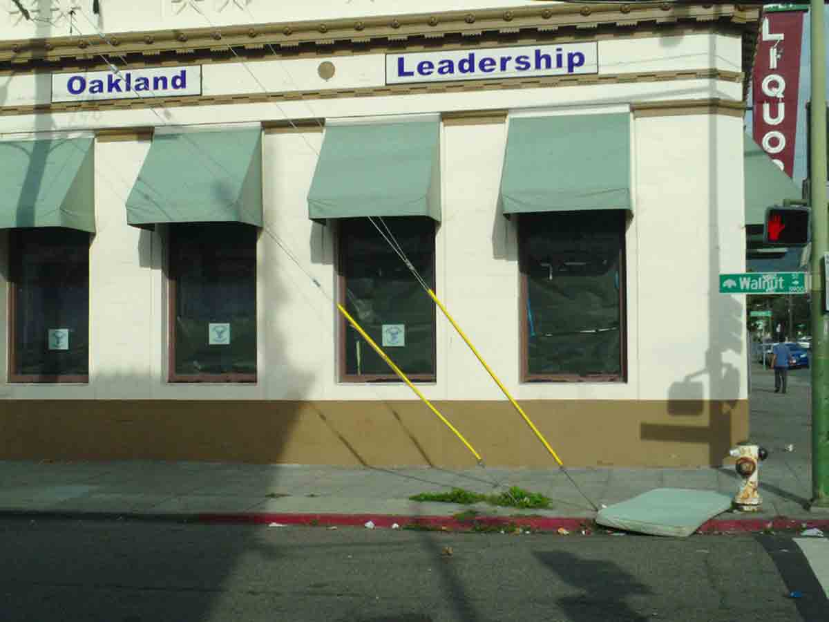 Charter school with mattress in front on sidewalk