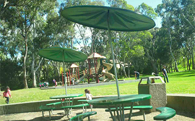 Playground and picnic tables at Hercules Park