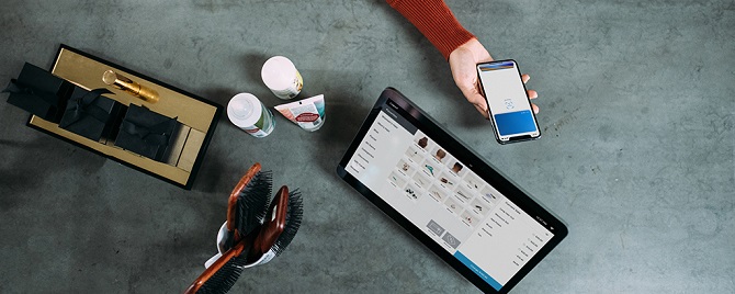 Person completing a purchase using a smartphone app