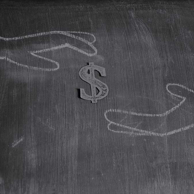 Dark chalkboard background with hand drawn chalk outlines of hands reaching for a symbol of the Dollar