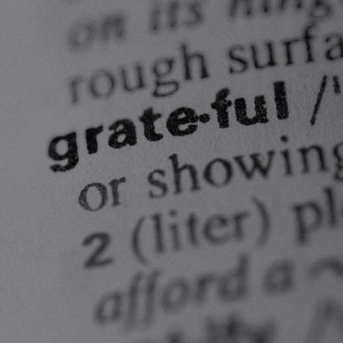 Close-up dictionary image of the word 'grateful'
